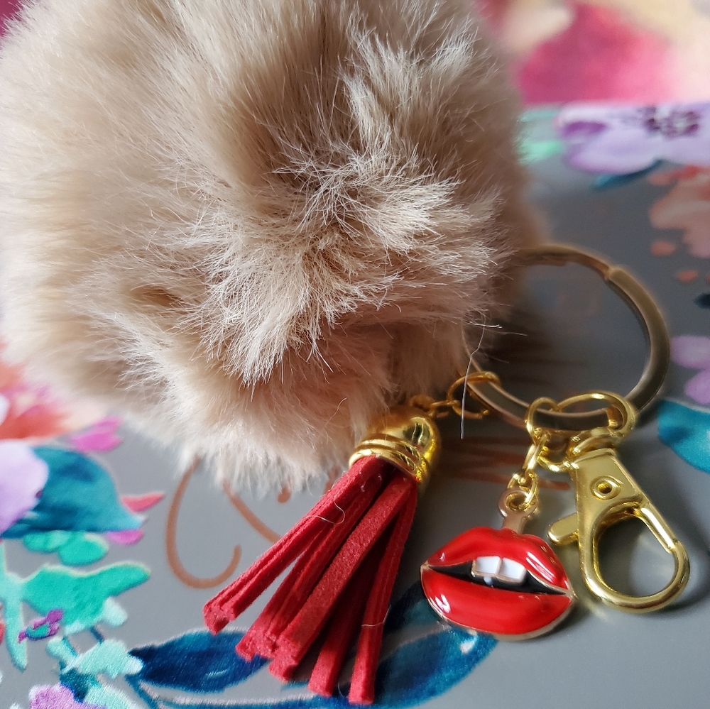 Pom Pom keychain with red lips 👄and red tassle